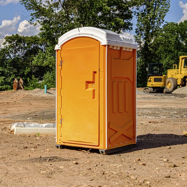 what is the cost difference between standard and deluxe portable restroom rentals in Sigourney